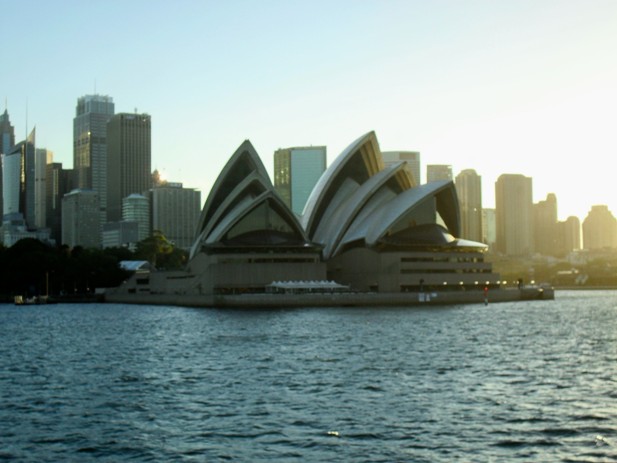 A view of the Sydney Opera House from across the harbour in the evening sun 