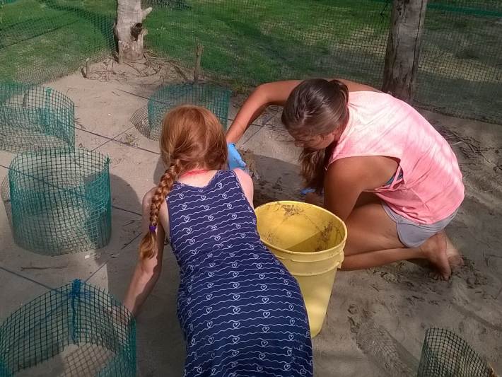 Two girls working in the turtle hatchery in Costa Rica 