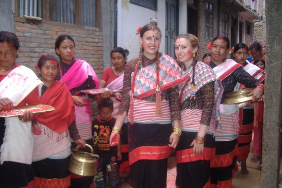 Oyster volunteers in traditional dress at school