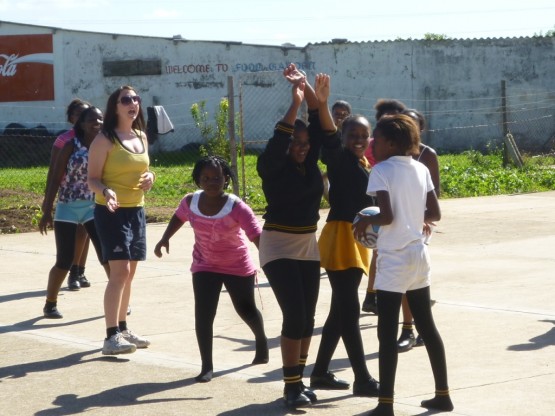 Oyster volunteer coaching netball in Port Elizabeth