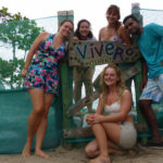 Volunteers stand proudly outside the beach hatchery