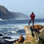 Volunteer sports coach looks out over the stunning views in South Africa