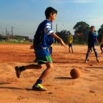Kid kicking a football