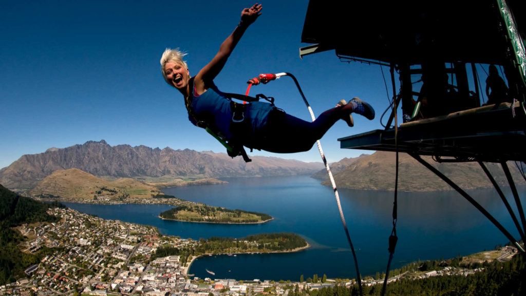 Girl bungee jumping out of a plane