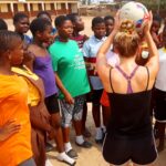 Netball coach holding a ball
