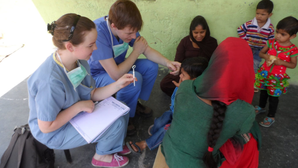 Interns working at a dental camp in northern India