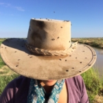 Akubra hat covered in flies