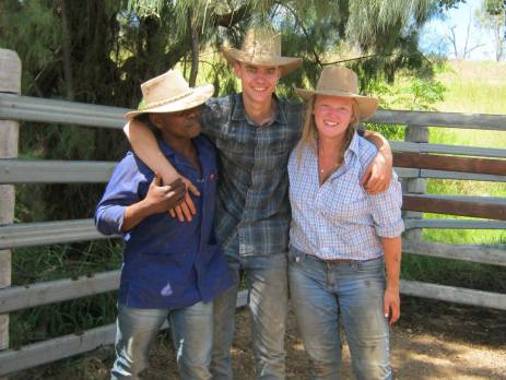 Three trainees smiling at the camera wearing work hats in Australia and shading themselves from the hot Australian sun. 