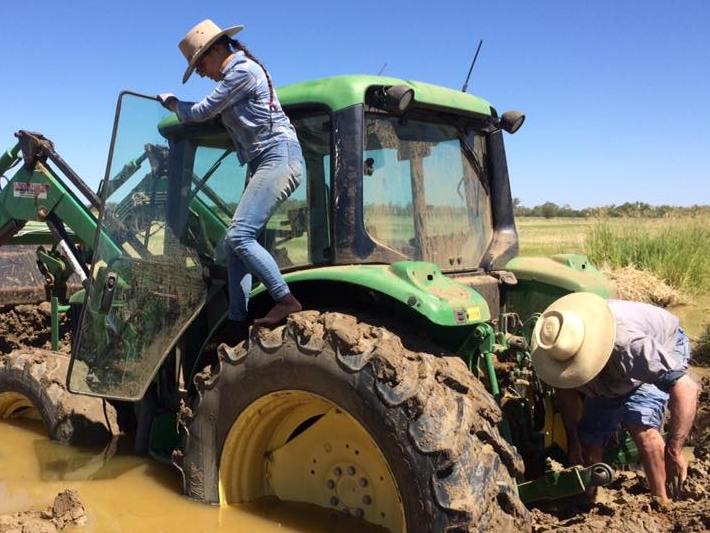 Tractor stuck in a muddy puddle 