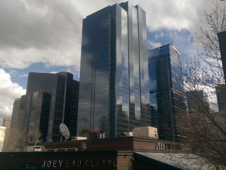 Calgary skyscraper with reflection near Eau Claire Park