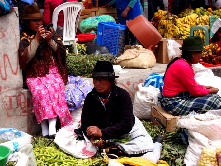 The local women sell their wares in local markets in Ecuador