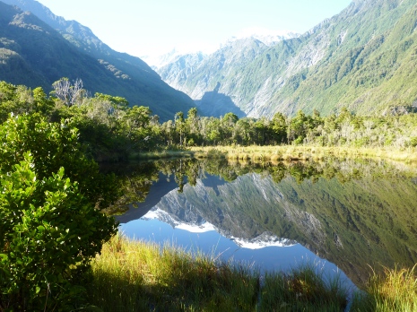 Reflection of mountains on a lake in New Zealand