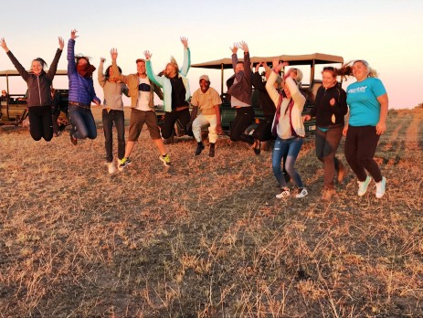 group jumping at the game reserve with oyster volunteers in south africa