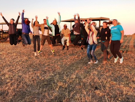 group jumping at the game reserve with oyster volunteers in south africa