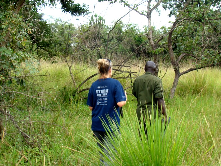 A volunteer and ranger track rhinos at the sanctuary in Uganda