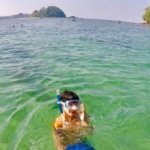 Turtle conservation volunteer gets ready to go and do some snorkelling on the reef