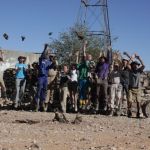 Volunteers celebrate having completed their building project