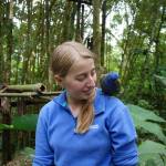 Volunteer at the wildlife sanctuary meets one of the rescued animals