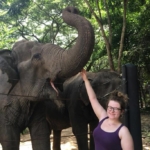 A volunteer enjoys meeting rescued elephants in Thailand