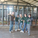 Volunteers cleaning out the elephant enclosures in South Africa