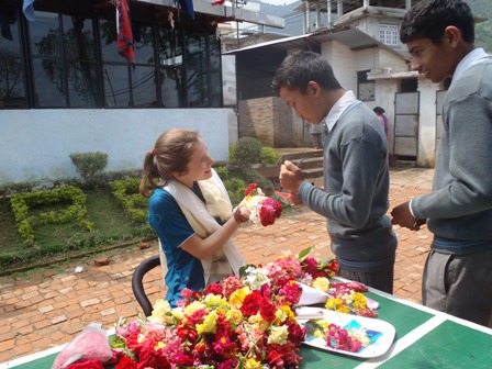 Receiving flowers on my final day at Crescent Academy