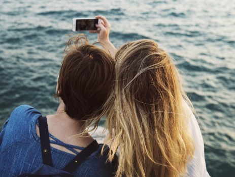 Two girls taking a selfie whilst travelling