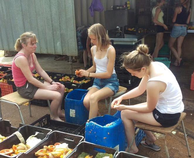 family preparing food for monkeys