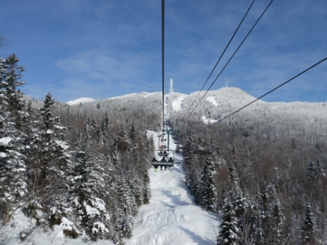 Tremblant Quebec chairlift up the mountain in snowy conditions